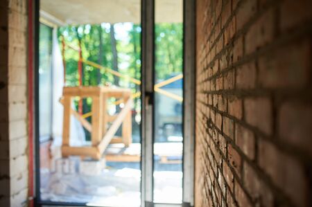 Building, construction site in progress to new house, brick wall in the room.の写真素材