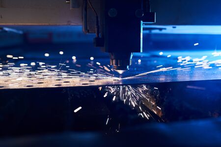 CNC Laser cutting of metal close up, modern industrial technology. Small depth of field.