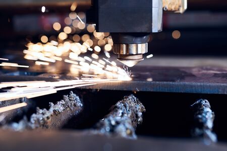 CNC Laser cutting of metal close up, modern industrial technology. Small depth of field.の写真素材