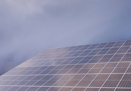 Solar panel against cloudy sky.