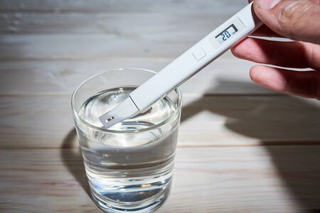 A researcher uses a electric water tester to test the electrical conductivity, TDS, and salt content...