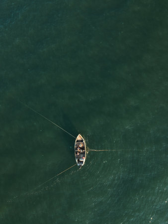 Aerial of a traditional fisher boat in the sea. Ukraine, Azov sea. Drone photo.の写真素材