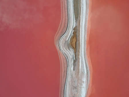 Aerial view of a pink salt lake. Azov Ukraine. Drone photo.