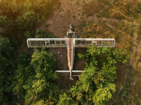 Old abandoned airfield with abandoned planes. Aerial top view.