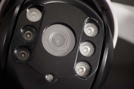 surveillance camera isolated on black background, studio shot, closeup.