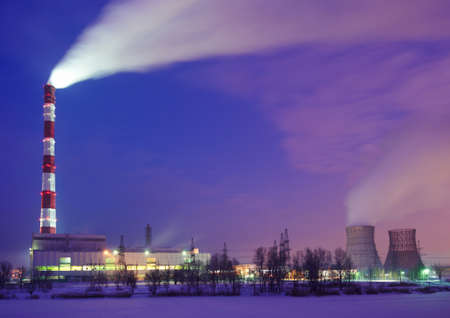 Air pollution smoke from pipes and factory at night.の写真素材