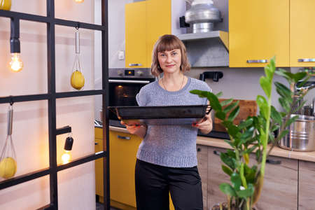 attractive woman in the kitchen.の写真素材
