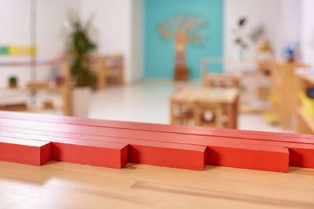 Light class in Montessori kindergarten. The red rods in the foreground. nobody.の写真素材
