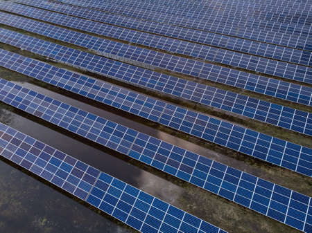 Aerial view of solar power station in the field for generation power from sun. no people