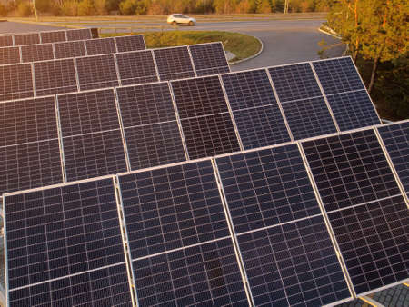 solar panel charging station for electric vehicles near the highway, no people