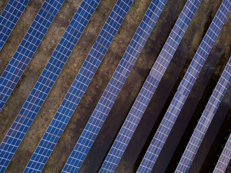 Aerial view of solar power station in the field for generation power from sun. no peopleの写真素材