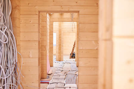inside a wooden house under construction, no people.