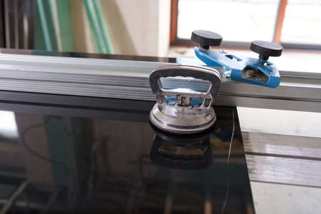 professional ceramic cutter and ceramic tile close up no people