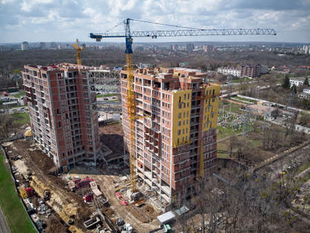 Busy Construction Site and Construction Equipment Aerial Photo top shot