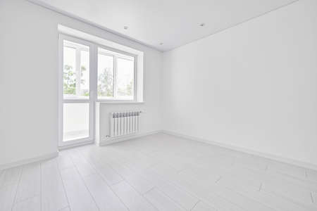 Modern light white empty living room with window. No people