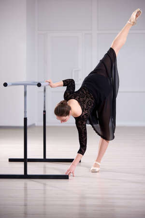 Beautiful ballerina training in the bright classの写真素材