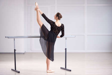 Beautiful ballerina training in the bright classの写真素材