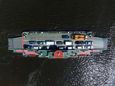 Aerial view of Ferry boat transport cars in the river. Beloslav, Bulgaria
