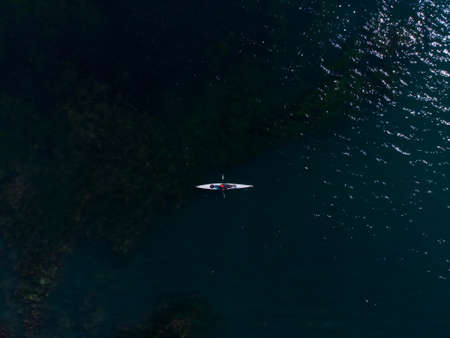 Aerial view of a small group of people sea kayaking