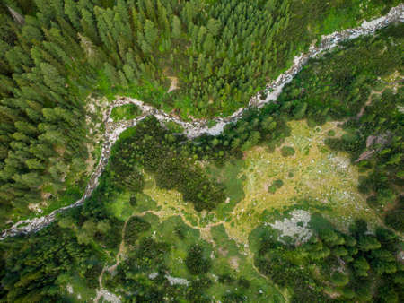 Aerial view of a stream in the Pirin mountains with clear water. Bansko, Bulgaria.の写真素材