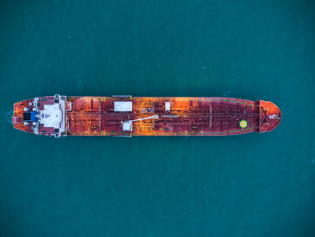 Aerial view oil ship tanker carrier oil on the sea at sunriseの写真素材
