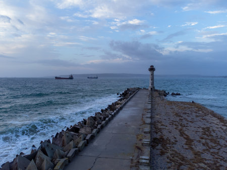 flying around the lighthouse on a drone early in the morning at sunrise