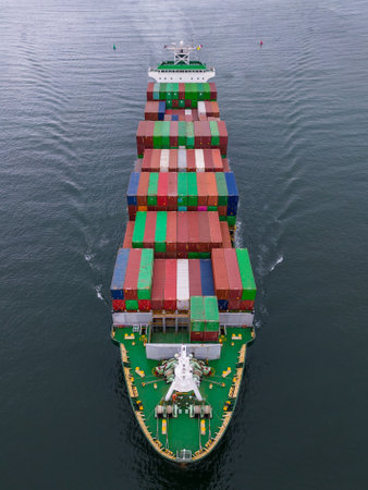Aerial top view container ship in the sea, shipping or transportation concept background.