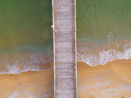 Aerial top down view of a wooden deserted pier in the seaの写真素材