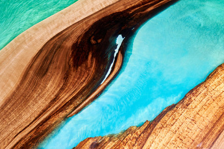 Texture of a wooden table with epoxy resin.の写真素材