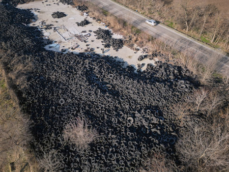 Aerial view of old tires. Many car and truck tires on dump site from aboveの写真素材