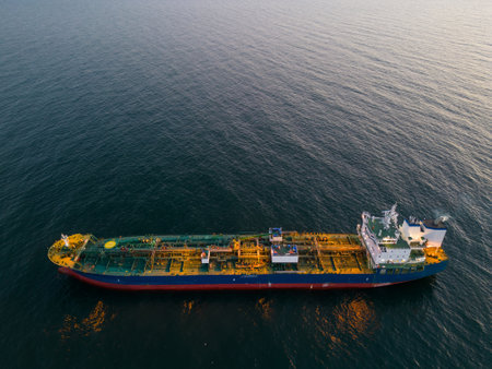 Aerial top view oil ship tanker carrier oil on the sea at sunsetの写真素材