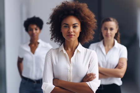 A business team with a curly-haired, pretty, and smiling black woman as the leader in a modern and bright office can represent diversity, inclusion, and leadership. The selective focus on the leader can highlight her confidence and competence, creating an engaging and inspiring atmosphere in the photograph. Generative AIの素材