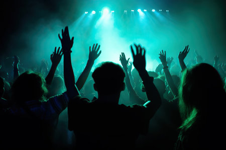silhouette of people with hands up at a concert or music festival illuminated by vibrant neon lights, conveying the excitement and energy of live music events. The image captures the enthusiasm of the crowd and the electrifying atmosphere of a live performance. Generative AIの素材