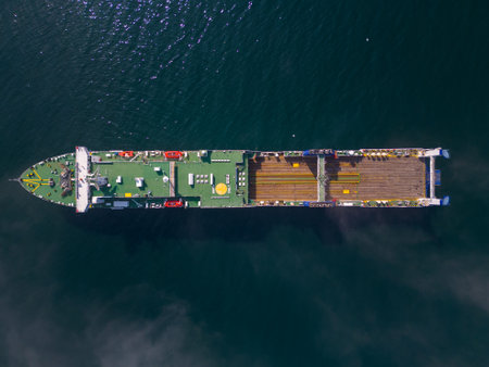 ferryboat in the sea aerial view on a sunny day. This vantage point can offer a unique and expansive view of the ferryboat and its surroundings, potentially showcasing the scale of the vessel and its journey.の写真素材