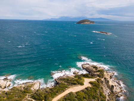 A top down aerial view of rocks and ocean.の写真素材