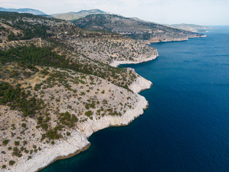 A top down aerial view of rocks and ocean.の写真素材