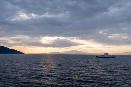 Ferries are large boats designed to transport people, vehicles, and cargo across open bodies of water, such as oceans and seas. These vessels are an essential mode of transportation for island communities, coastal cities, and international travel.の写真素材