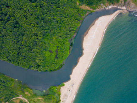 An aerial top view of the rocky coastline of the Black Sea in southern Bulgaria near Sinemorets town, showcasing its rugged beauty and coastal splendor.の写真素材