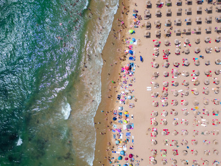 aerial top view of Bulgaria's Golden Sands resort during the summer season: an array of hotels, pools, and crowds of people enjoying the sea.の写真素材