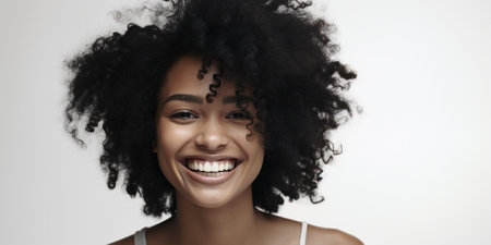 A very beautiful 30-year-old black woman with a gentle smile against a white background. natural charm and inner beauty. Generative AIの素材