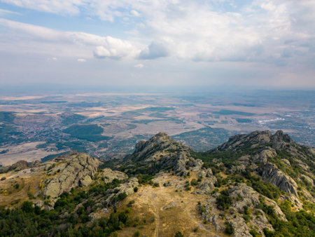 Aerial view unfolds of the rugged peaks of Bulgarias Stara Planina mountains, towering majestically above the earth.の写真素材