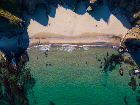 Aerial view of the rocky, wild coast of the Black Sea in Bulgaria, with cliffs, beaches, and green forestsの写真素材