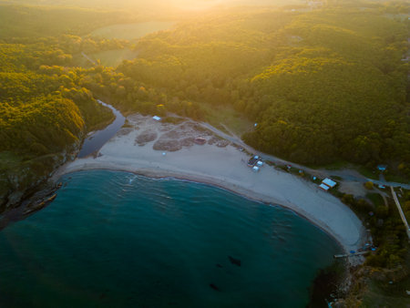 Aerial view of the rocky, wild coast of the Black Sea in Bulgaria, with cliffs, beaches, and green forestsの写真素材