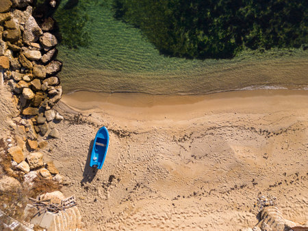 Aerial view of a fishing boat on the shore of the seaの写真素材