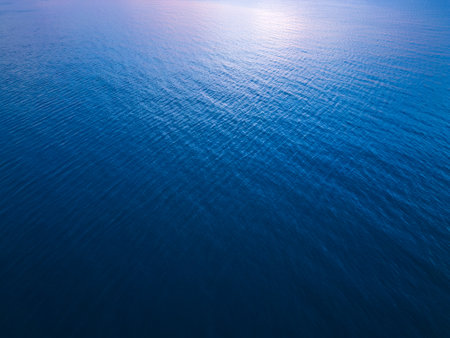 Aerial view of the sea surface reflecting the skyの写真素材