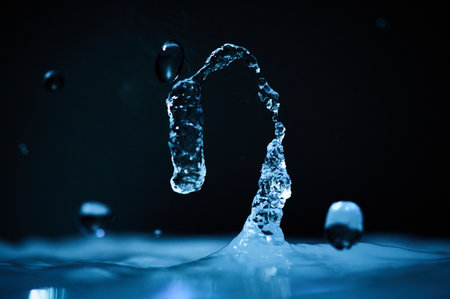 The process of boiling water, a stream of water shooting out of a humidifier or diffuser taken in...