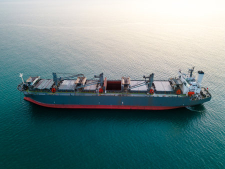 A massive cargo ship wood chips carrier in the sea, aerial view.の写真素材