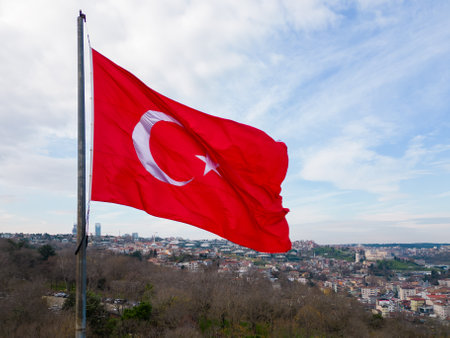 Turkish flag waving in close-up against the backdrop of Istanbulの写真素材