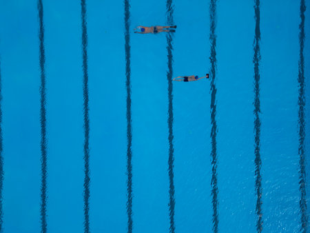 Man Swimming Shirtless in Pool