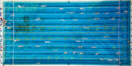 Group of People Swimming in a Pool